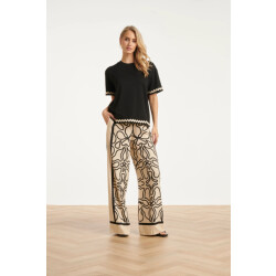 Smashed Lemon Crème wide leg broek met zwart grafisch patroon |